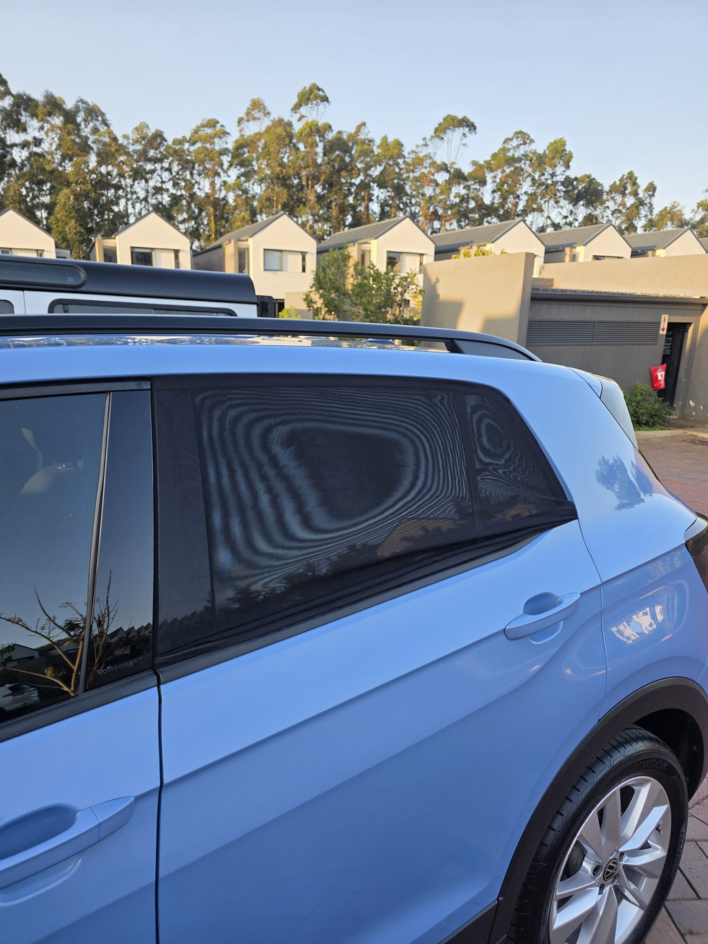 Sun shade socks fitted to the rear windows of a VW T-Cross